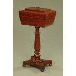 A William IV mahogany teapoy, of sarcophagus form, with hinged lid to fitted interior,