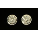 A pair of 18 ct white gold diamond set ear studs, rubover, diamond weight +/- 1.59 carats.
