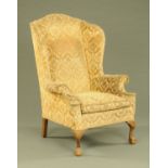 A Queen Anne style wing chair,