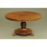 A William IV rosewood breakfast table, circular, with snap action and faceted column,