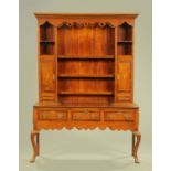 A George III oak and mahogany banded dresser with delft rack,