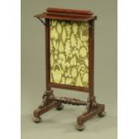 A William IV mahogany framed fire screen, with rise and fall action. Width 43 cm.