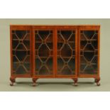 An Edwardian mahogany breakfront glazed bookcase,