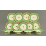 A 19th century porcelain fruit set, with a green border and heightened with gilding,