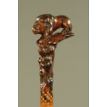 A 19th century cane, with root carved handle in the form of a lion. Length 88 cm.