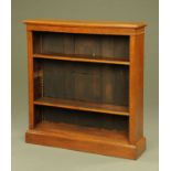 An Edwardian oak open bookcase,