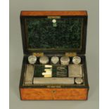 A good Victorian walnut veneered toiletry set,