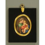 A 19th century Continental porcelain plaque, mother with child, oval,