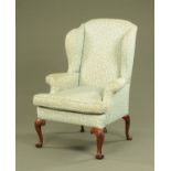 A Queen Anne style wing easy chair, with loose cushion,