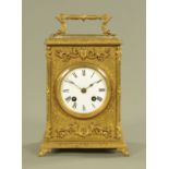 A 19th century brass mantle clock, with enamelled dial and two train striking movement.