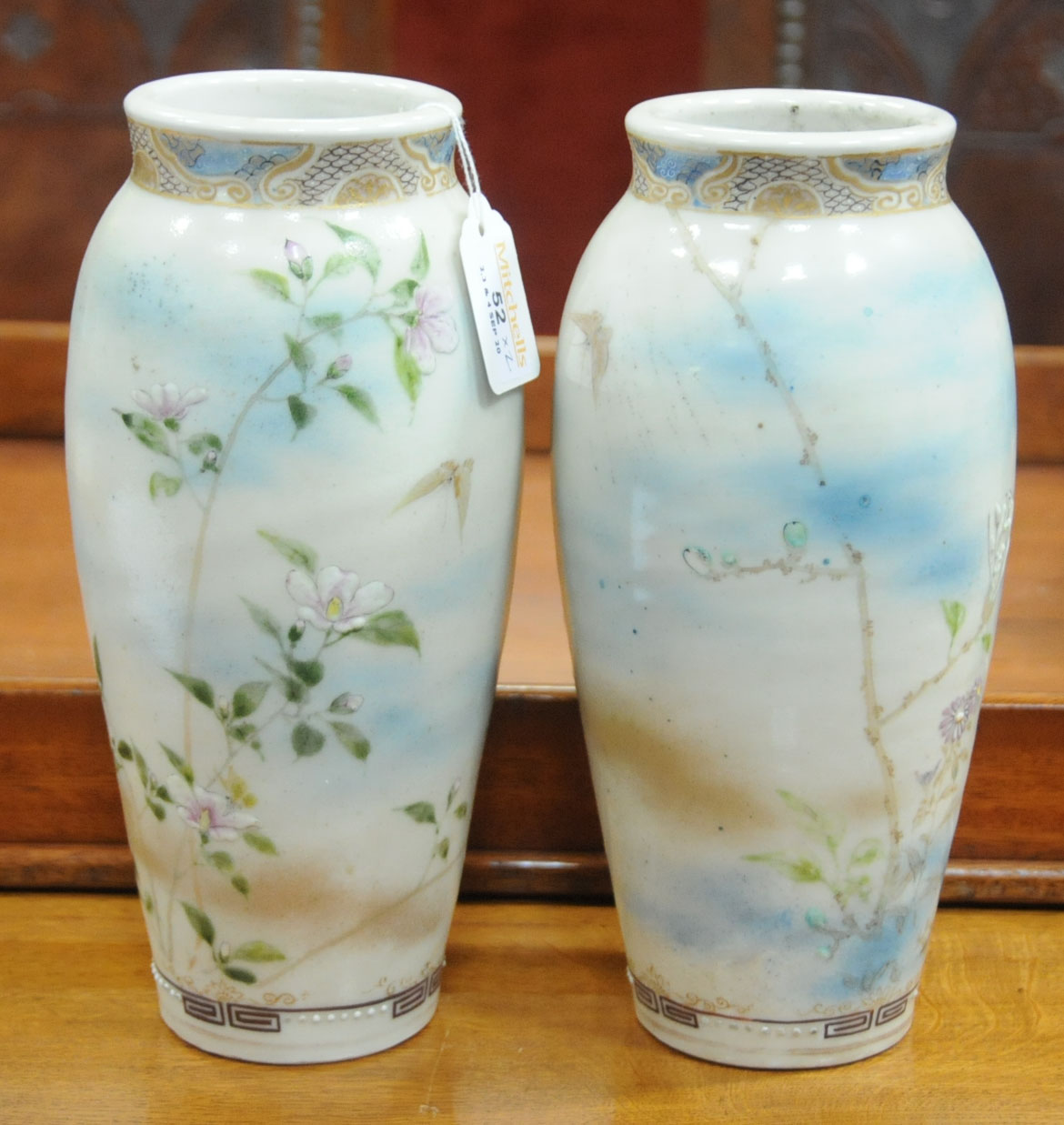 A pair of Japanese Satsuma vases, decorated with butterflies and branches with flowers. - Image 2 of 7