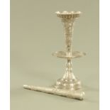 An Eastern silver coloured metal single flute epergne, with conical foot repousse with palm trees,