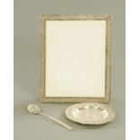 An Eastern silver coloured metal rectangular photograph frame, 26 cm x 21 cm,