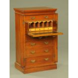 A late Victorian oak secretaire Wellington chest,