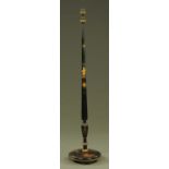 A chinoiserie black lacquered and painted lamp standard, with tasselled shade.