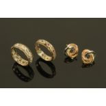 A pair of 9 ct gold ear studs, and two eternity rings.