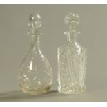 An Irish cut glass decanter with stopper, and another. Height 29 cm.