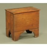 A fireside cracket style stool box, with leather hinge. 35 cm x 44 cm x 28 cm.