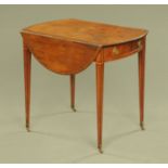 A Georgian mahogany crossbanded Pembroke table, with frieze drawer and dummy drawer,