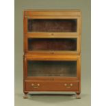An Edwardian mahogany four tier sectional bookcase,