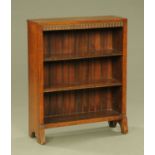 A small Edwardian oak open bookcase, with knulled frieze and two adjustable shelves. Width 75 cm.