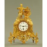 A 19th century French spelter figural mantle clock, with single-train movement and enamelled dial.