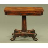 A William IV rosewood turnover top games table, with crossbanded edge and rounded corners,