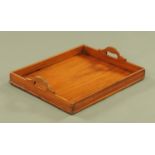 A mahogany tray, with integral carrying handle to either side. Width 56 cm.