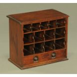 A 19th century mahogany table top pigeonhole cabinet, also fitted with a single drawer.