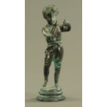 A bronze figure of a young boy, in standing pose with arms raised to hold a musical instrument.