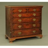 A George III oak and mahogany banded chest of drawers,