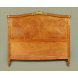 A Continental quarter veneered bed head,