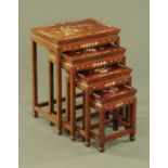 A nest of four Chinese tables, inlaid with mother of pearl. Widest 50.5 cm.