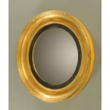 A 19th century Regency style circular convex gilt wood framed mirror. Diameter 53 cm.