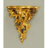 A Venetian carved and gilt wood wall bracket. Width 23 cm, height 23 cm.