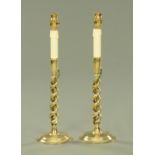 A pair of brass barley twist table lamps, on circular bases, overall height 46.5 cm.