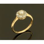 A 9 ct gold pearl and diamond set ring, size O.