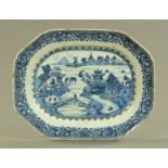 A late 18th/early 19th century Chinese blue and white Willow pattern plate. Length 36.5 cm.