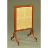 A 19th century mahogany fire screen,