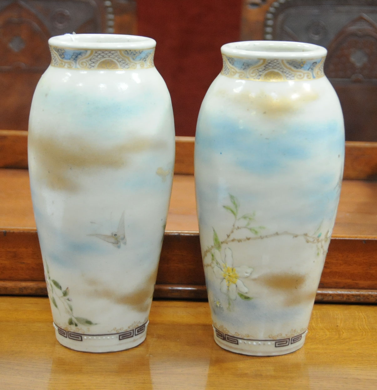 A pair of Japanese Satsuma vases, decorated with butterflies and branches with flowers. - Image 4 of 7