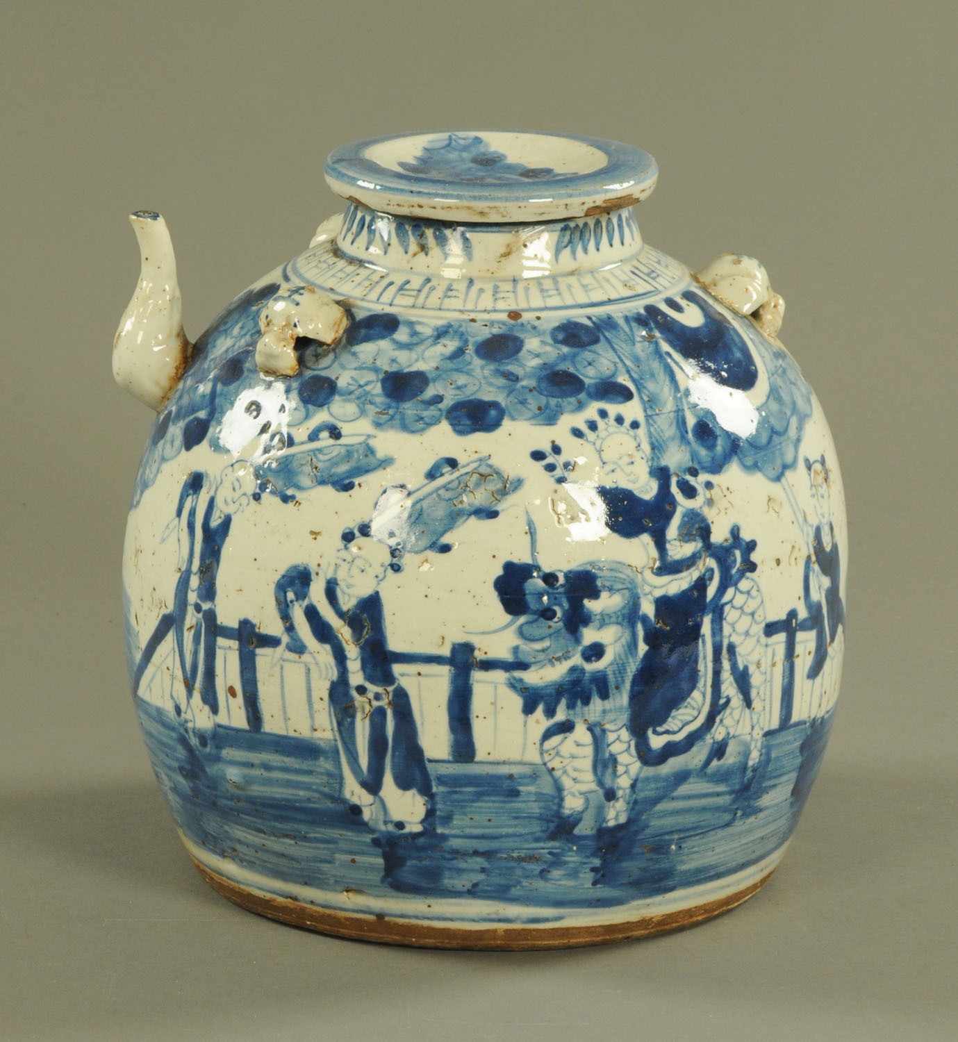 A large Chinese blue and white wine pot, decorated with a series of figures. Height 28 cm.