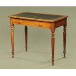 A Victorian mahogany writing table, with leatherette writing surface,