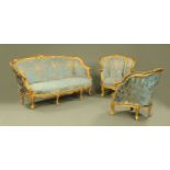 A three piece gilt wood lounge suite, comprising settee and two chairs,