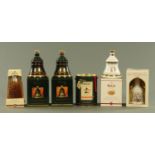 Bells Whisky comprising a millennium 2000 70 cl bottle and six bell shaped whisky decanters