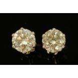 A pair of 18 ct white gold stud earrings, set with diamonds weighing +/- 4.08 carats.