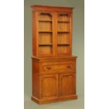 A Victorian mahogany secretaire bookcase, with moulded cornice above a pair of glazed doors,