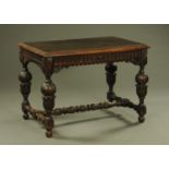 A Victorian carved oak side table,