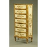 An Italian gilt and white painted chest of seven drawers, raised on cabriole legs, circa 1960.