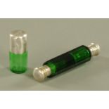 A Victorian green faceted glass double ended scent bottle, and a green glass standing scent bottle,