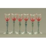 Six Bohemian cranberry overlay iridescent wine glasses. Height 16 cm.